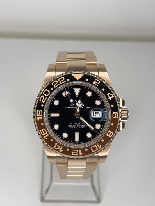 ROLEX GMT-MASTER II - ROSE GOLD - BLACK DIAL - BLACK AND BROWN BEZEL