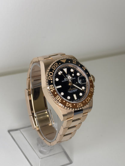 ROLEX GMT-MASTER II - ROSE GOLD - BLACK DIAL - BLACK AND BROWN BEZEL